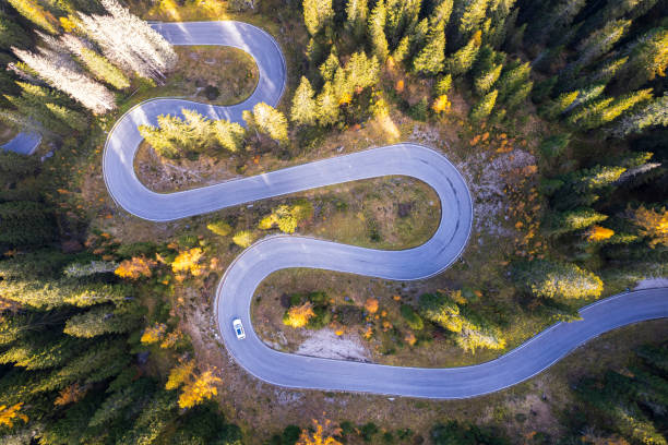 istock Car on empty serpentine road, Dolomites 2182659715