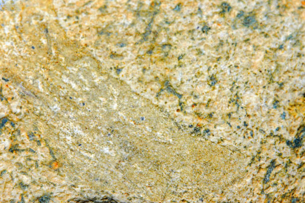 Colorful yellow old stone background with dark cracks, great for your design and texture background