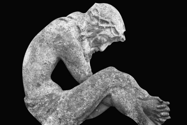 istock Ancient statue of Jesus Christ against black background. Horizontal black and white image. 2182662817