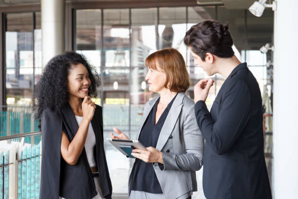 istock Group of businesspeople taking together inside the building. 2182665562