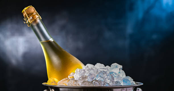 istock Bottle of sparkiling wine in bucket with crushed ice. 2182666158