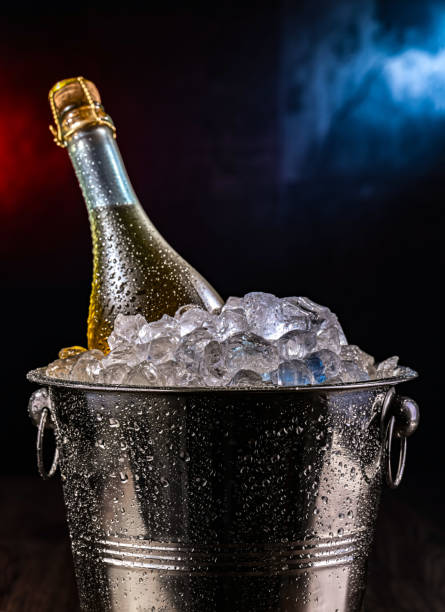 istock Bottle of sparkiling wine in bucket with crushed ice. 2182666240
