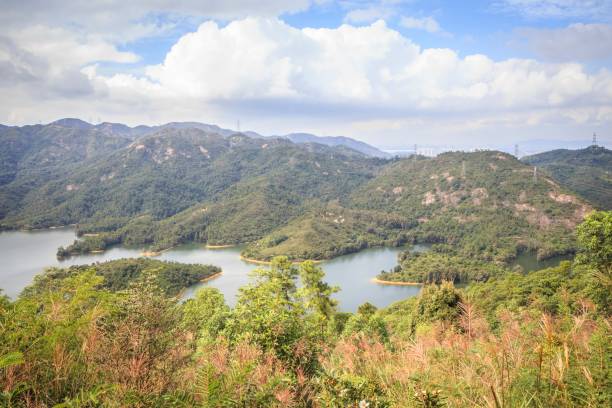 istock Serene Mountain Lake with Rolling Hills and Blue Sky 2182667366