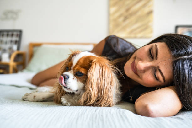 istock Young woman enjoys time with her dog 2182667756