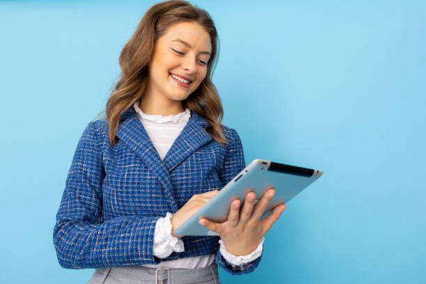 istock Young businesswoman engaged with her tablet device 2182667925