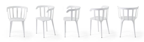 Portrait of crazy young man sitting on chair with his legs up over white background