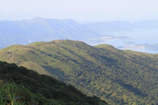 istock Panoramic View of Rolling Hills and Distant City 2182668063