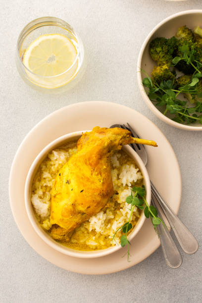 istock Stewed rabbit with rice, broccoli , served table with food 2182668450