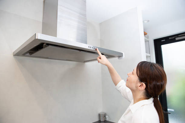 istock Range hood, Japanese woman operating it 2182670038