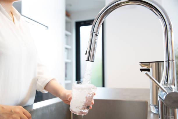 istock Safe tap water pouring water into a glass 2182670060