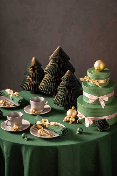 istock Beautiful green Christmas tableware for two with bubbles and gifts. 2182670384