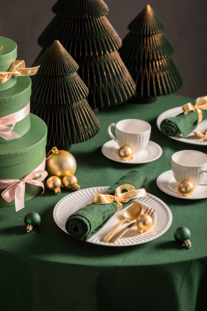 istock Beautiful green Christmas tableware for two with baubles and decorations. 2182670540