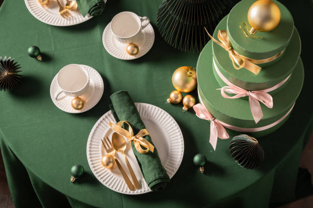 istock Modern green Christmas tableware for two as gift card. 2182670669