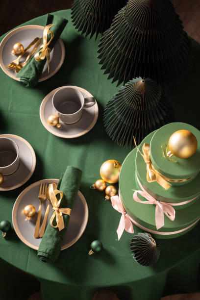 istock Wonderful green Christmas tableware for two with tableware and presents. 2182670856