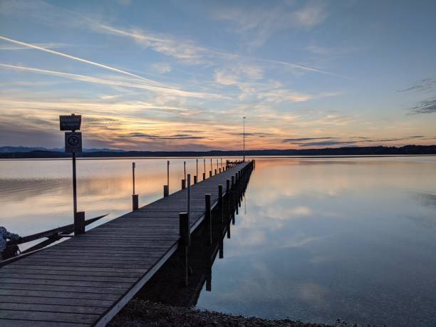 istock Jetty and lake in a dramatic sunset 2182672395