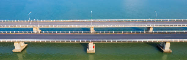istock Cement bridge across the lake 2182672739