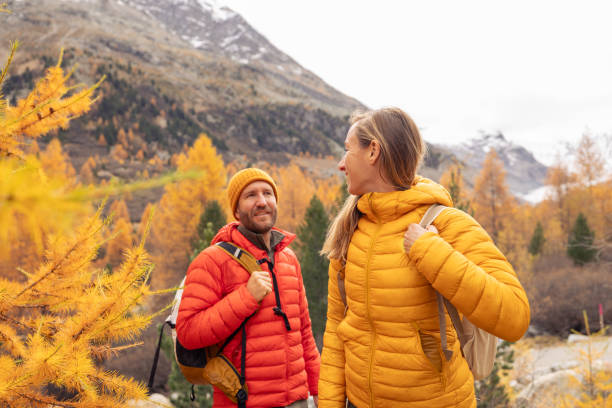 istock Couple Enjoying Scenic Fall Hike in Mountain Landscape 2182673072