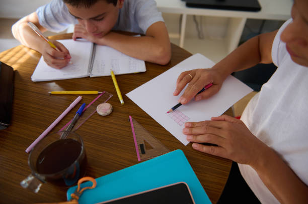 istock Children engaged in home learning activities at the table 2182673877