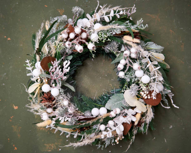 istock Christmas wreath with white branches on a dark background 2182674726