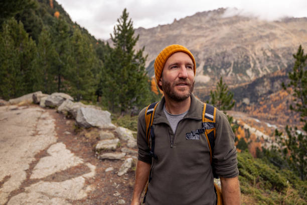 istock Smiling Hiker Enjoying a Mountain Trail in Autumn 2182674994