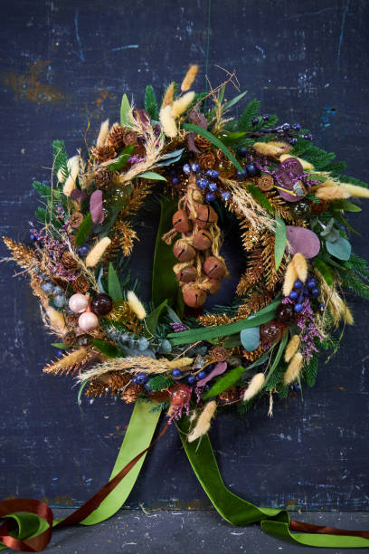 istock Christmas modern wreath with dried flowers on a dark background 2182675013