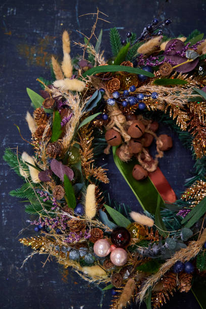 istock Christmas modern wreath with dried flowers on a dark background 2182675708