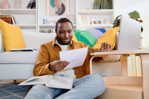 istock Motivated student preparing his exam in the living room 2182677355