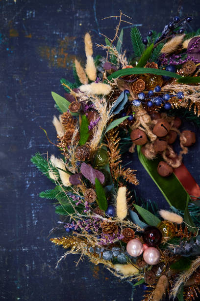 istock Christmas modern wreath with dried flowers on a dark background 2182677402