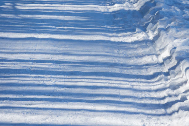 traces in winter in blue snow - photo taken in deep sun for blue snow and relief effect