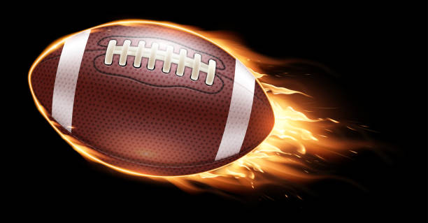 istock American football ball fire on a black background. Realistic illustration. 2182681426