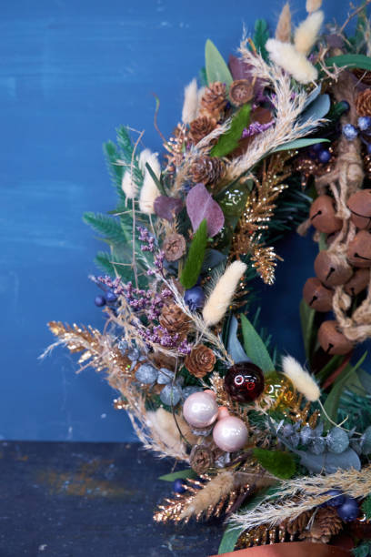 istock Christmas modern wreath with dried flowers on a dark background 2182682026