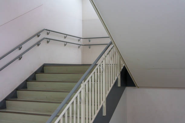 An indoor spiral staircase with a view from below