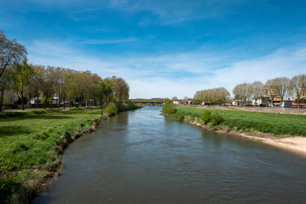 istock River Adour in Dax under blue sky and green grass 2182686576