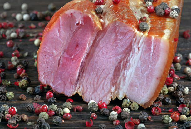 Delicious smoked bacon on a wooden board. close up