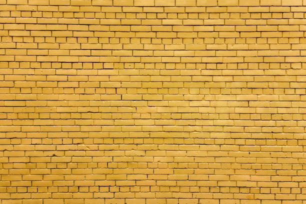 istock Home and office design backdrop wallpaper. Background of yellow brick wall texture. 2182687693