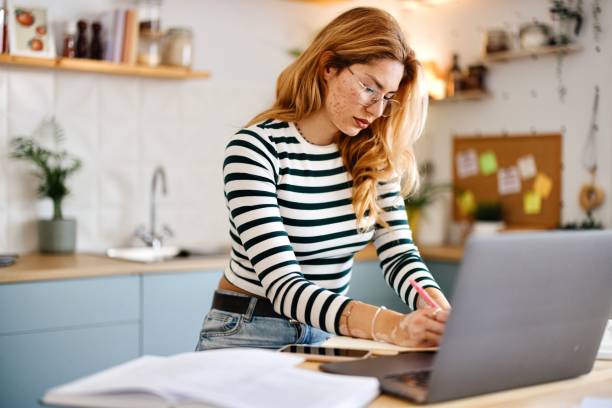 istock Side view of an occupied female preparing her exams 2182688000
