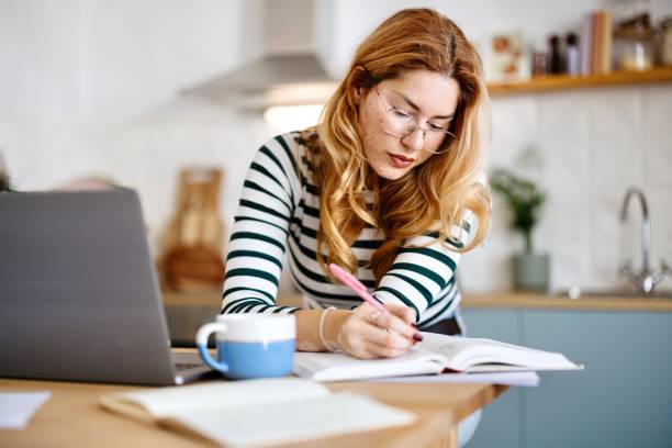 istock Close-up of a female student preparing her exams 2182688006