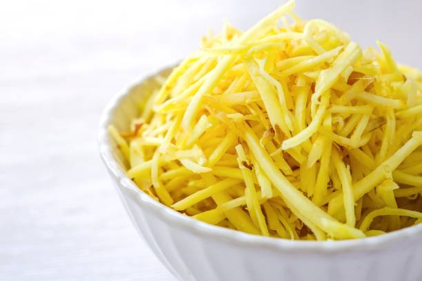istock ginger slices in white ceramic bowl on white background 2182689992
