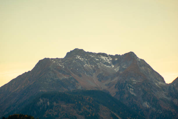mountains in autumn rocks, forest and sky