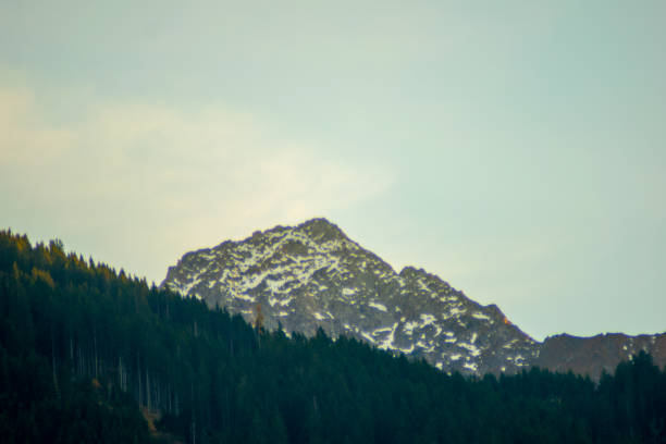 mountains in autumn rocks, forest and sky