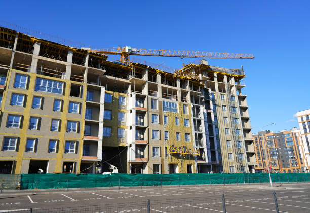istock Construction of Residential Building. Tower Crane on formworks. Modern House Construction. 2182691703