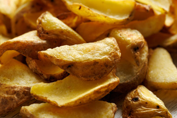 istock Fried potato dippers with ketchup on a white wooden board 2182691989