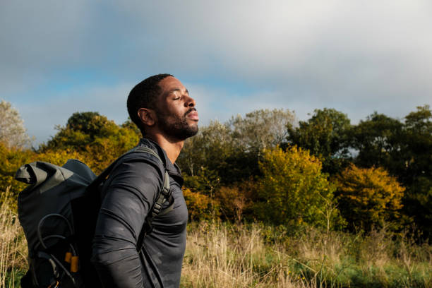 istock Hiker breathing fresh air in scenic forest landscape 2182695294