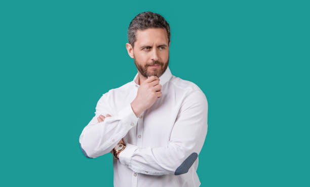istock handsome mature man isolated on blue background. mature man in studio. mature man 2182696206