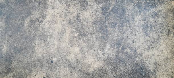 istock Dark grey concrete floor, rough and rugged texture. 2182700842