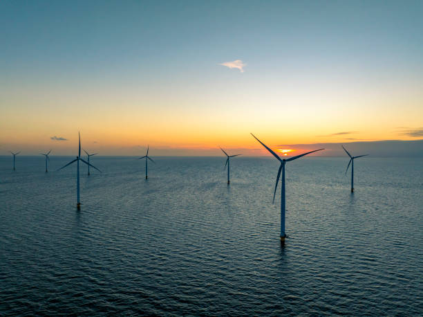 istock Wind turbines in an offshore wind park producing electricity 2182707600