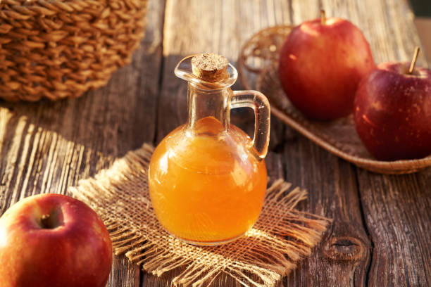 istock Apple cider vinegar in a glass bottle in sunlight 2182709646