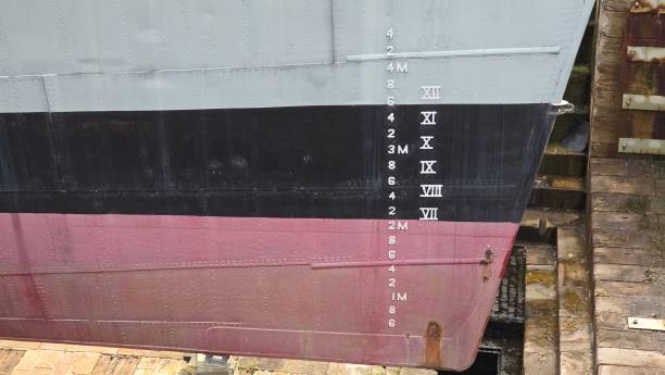 istock A draft mark or plimsoll line on the hull of a ship. These markings indicate how deeply a ship sits in the water and help ensure it isn’t overloaded. 2182710422