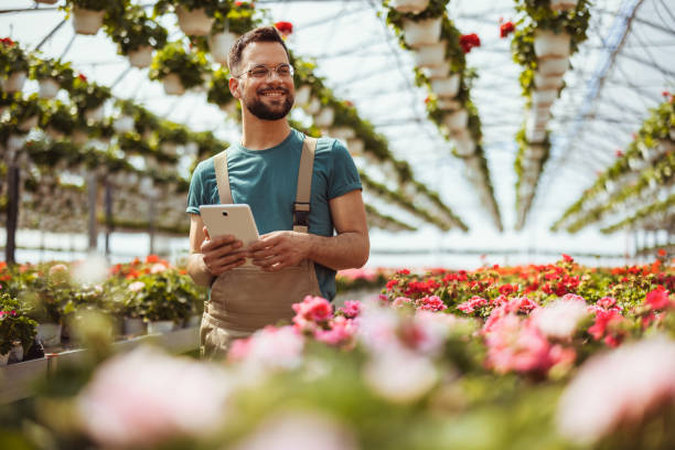 istock Florist man in a plant nursery 2182715257