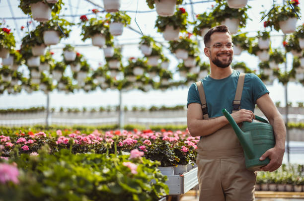 istock Florist man in a plant nursery 2182715296